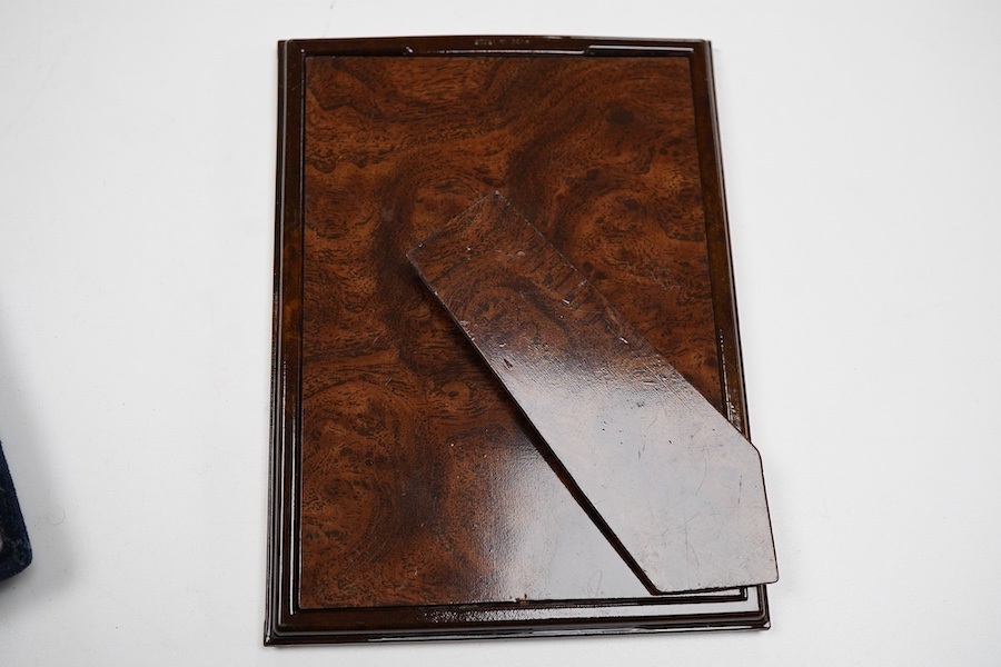 An Elizabeth II silver mounted photograph frame, with heart shaped aperture, Keyford Frames Ltd, Birmingham, 1992, 19cm by 14.4cm, together with an Italian 925 mounted rectangular photograph frame.